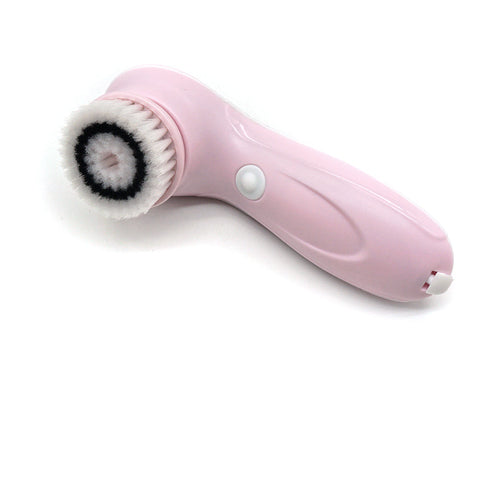 Pink skin care brush with bristle head on a white background