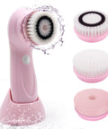 Pink facial cleansing brush with interchangeable heads on a white background