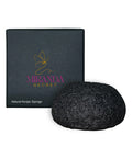 Black natural konjac sponge with Miranda Secret packaging on a white background
