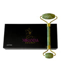 Green jade roller with gold accents on a black box labeled 'Miranda Secret' against a white background.