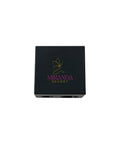 Black makeup compact with Miranda Kerr logo on a white background