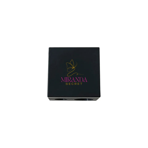 Black makeup compact with Miranda Kerr logo on a white background