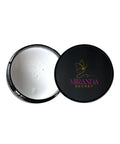 Open makeup compact with white powder and Miranda Kerr logo on a white background