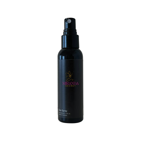 Black spray bottle with Miranda Kerr logo on a white background