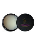 Open black jar of cream with 'Miranda Secret' branding on a white background