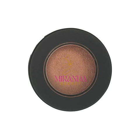 Makeup compact with brown shade and 'Miranda Secret' branding on a white background