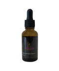 Amber glass dropper bottle with black cap on a white background