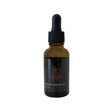 Amber glass dropper bottle with black cap on a white background