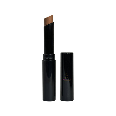 Black cosmetic stick with brown applicator on a white background