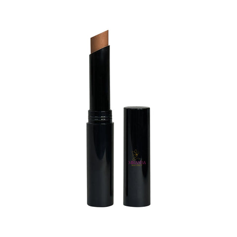 Black cosmetic stick with brown applicator on a white background