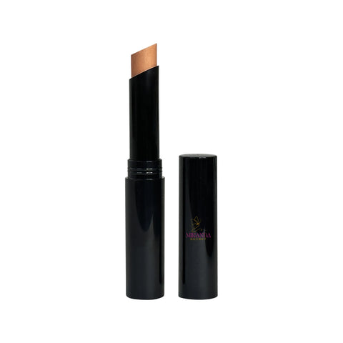 Black cosmetic stick with a beige applicator on a white background