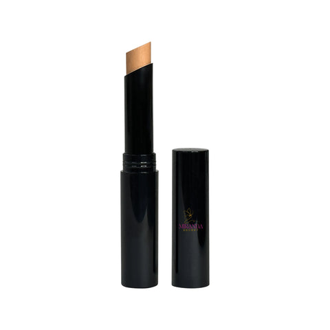 Black cosmetic stick with a beige applicator on a white background