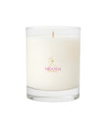White candle in a glass jar with 'Miranda' logo on a white background