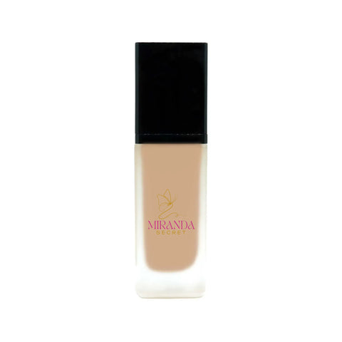 Foundation bottle with black cap and beige body on a white background