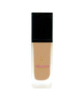 Foundation bottle with black cap and beige body on a white background