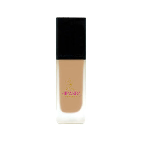 Foundation bottle with black cap and beige body on a white background