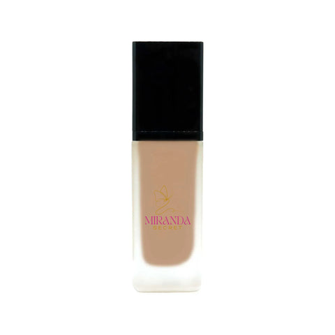 Foundation bottle with black cap and beige body on a white background