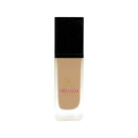 Foundation bottle with black cap and beige body on a white background