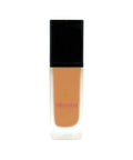 Foundation bottle with black cap and white base on a white background