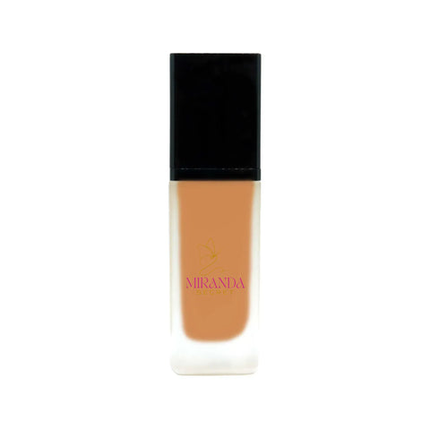 Foundation bottle with black cap and white base on a white background