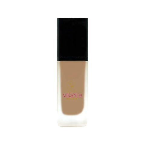 Foundation bottle with black cap and beige body on a white background