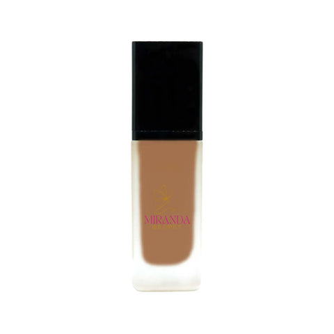 Foundation bottle with black cap and visible brand logo on a white background