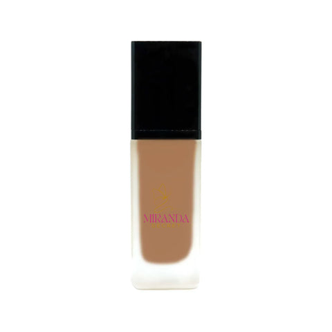 Foundation bottle with black cap and visible brand name on a white background