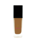 Foundation bottle with black cap and visible brand logo on a white background