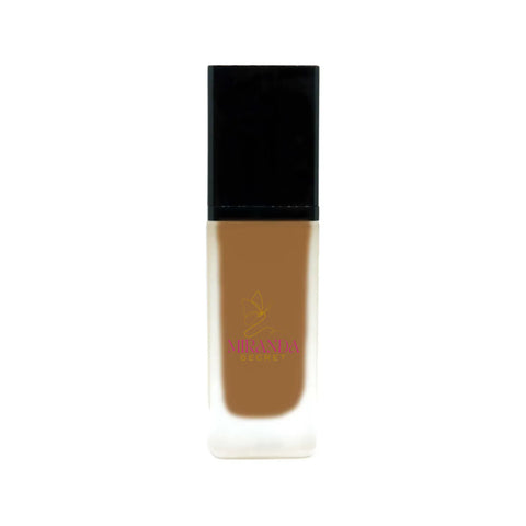 Foundation bottle with black cap and visible brand logo on a white background