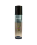Makeup remover bottle with black cap on a white background