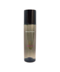Makeup remover bottle with black cap on a white background