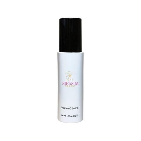White lotion bottle with black cap on a white background