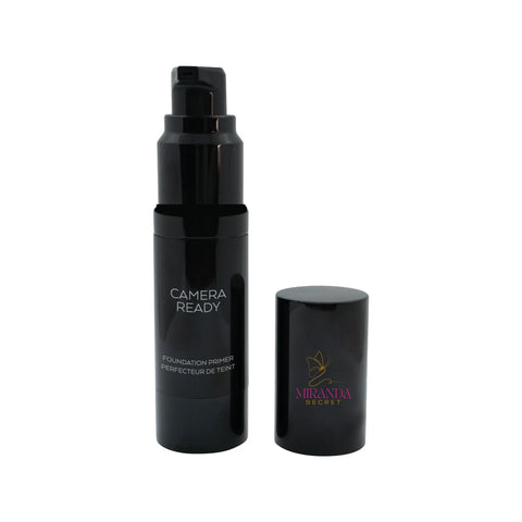 Black cosmetic bottle with pump and cap on a white background