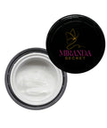 Open jar of cream with 'Miranda Secret' lid on a white background