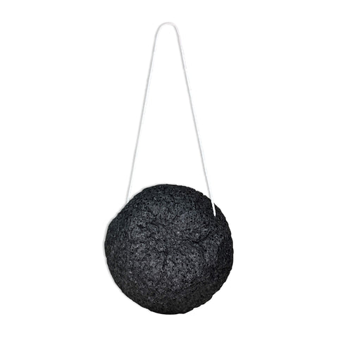 Black spherical object with a string on a white background