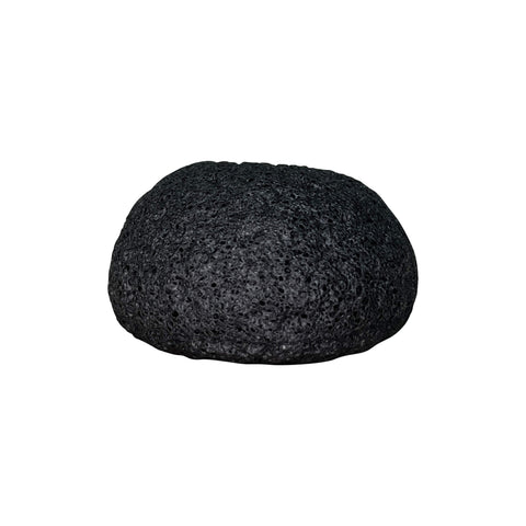 Black pumice stone on a white background