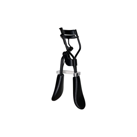 Black eyelash curler on a white background