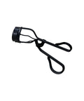Black eyelash curler on a white background
