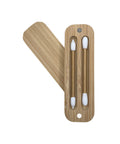 Wooden earbud case with three white earbuds on a white background