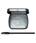 Compact powder with a brush on a white background