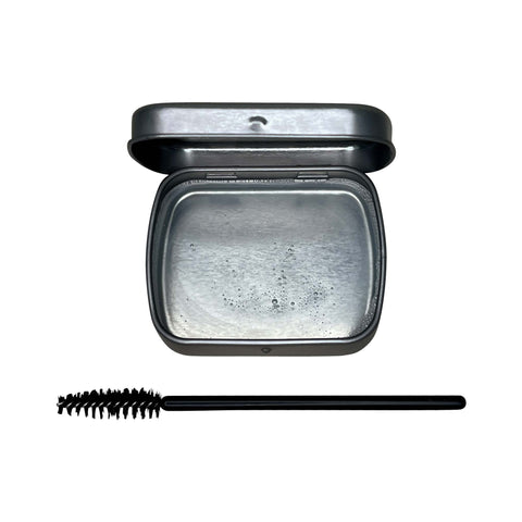 Compact powder with a brush on a white background