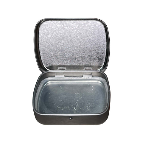 Compact mirror with speckled surface on a white background