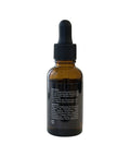 Brown glass dropper bottle with black cap on a white background