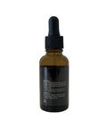 Brown glass dropper bottle with black cap on a white background