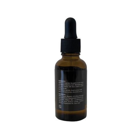 Brown glass dropper bottle with black cap on a white background