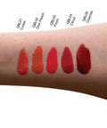 Lipstick swatches on a person's arm with color names above each swatch.