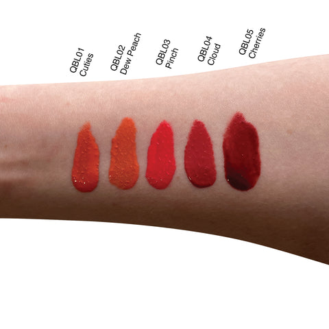 Lipstick swatches on a person's arm with color names above each swatch.