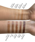 Swatches of different makeup shades on a person's arm with color names below.