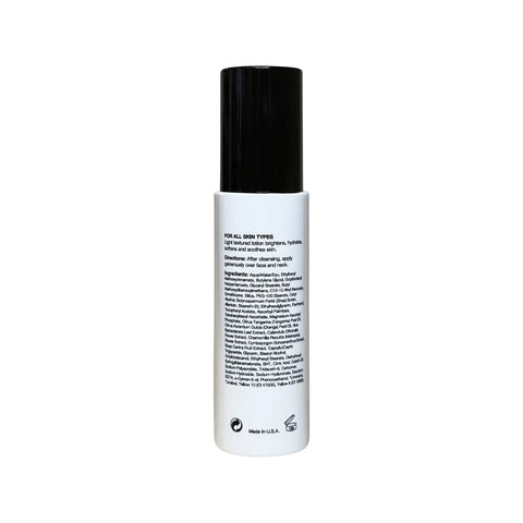 Skincare bottle with black cap and white label on a white background