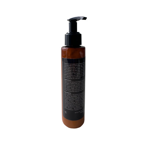 Brown bottle with pump dispenser on a white background
